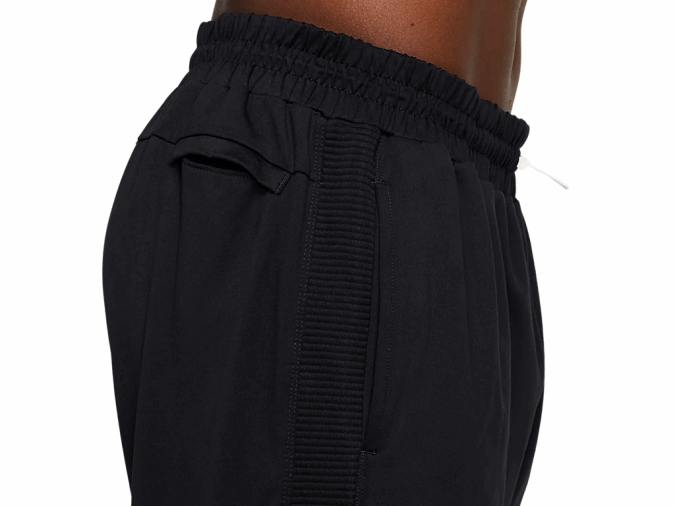 Pantalón cónico de polar Thermopolis Asics negro para hombre rendimiento cómodo y ligero - Image 4